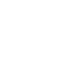 Silhouettes of runners racing toward a finish line with one jumper ahead and a crowd in the background.